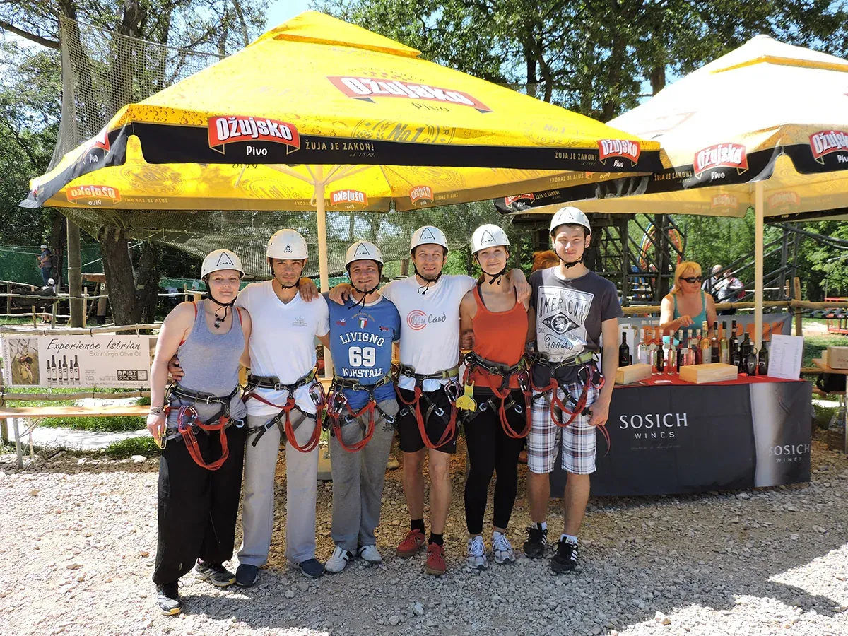 Group of visitors in harnesses at Glavani Park between activities